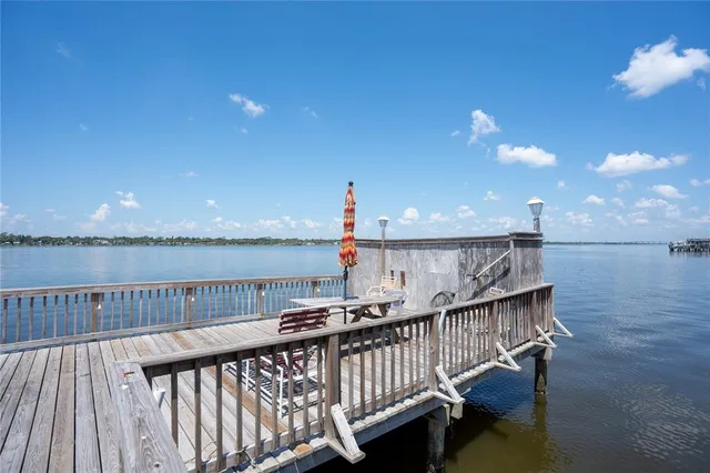 a view of swimming pool with outdoor seating