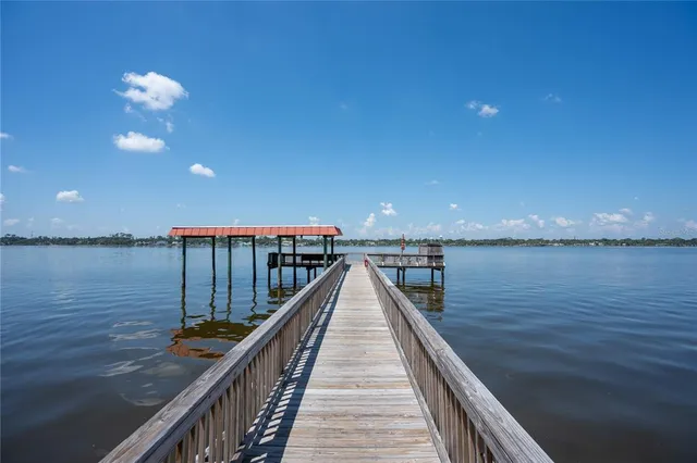 a view of a lake with a big yard