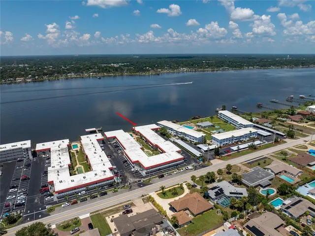 a view of a lake with a city skyline in the background