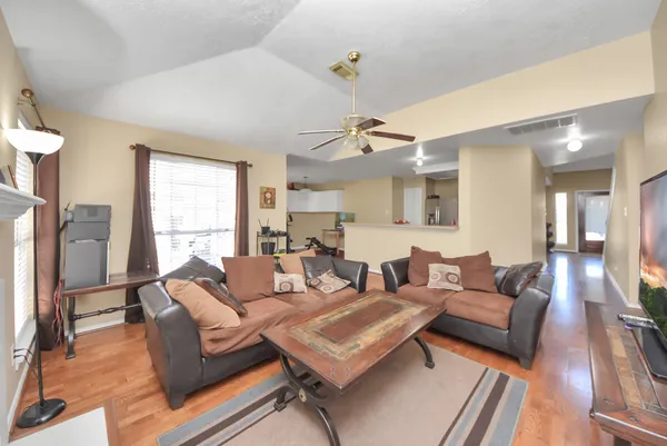 a living room with furniture and a large window