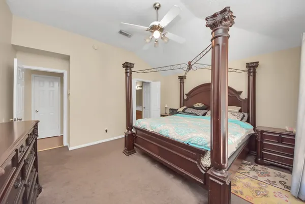 a room with stairs and a chandelier
