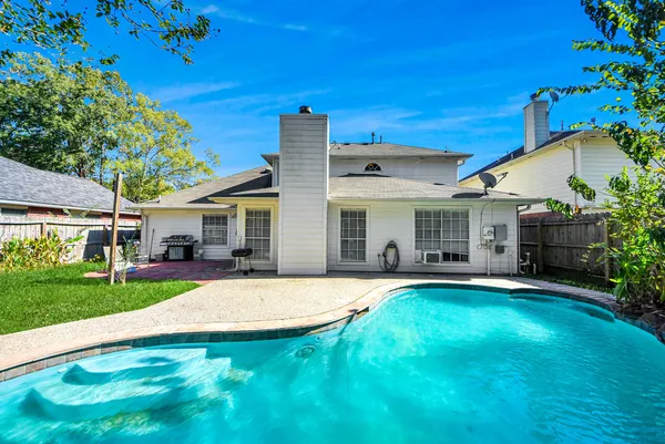 a view of a house with a yard porch and sitting area