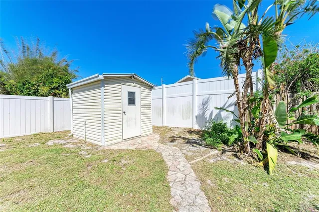 a view of a backyard of the house