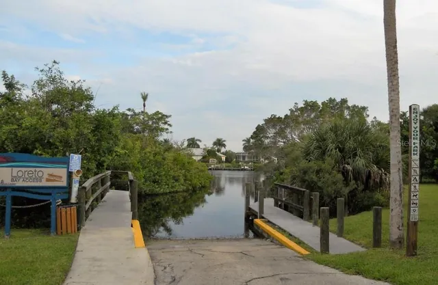 a view of a terrace with a garden and lake view