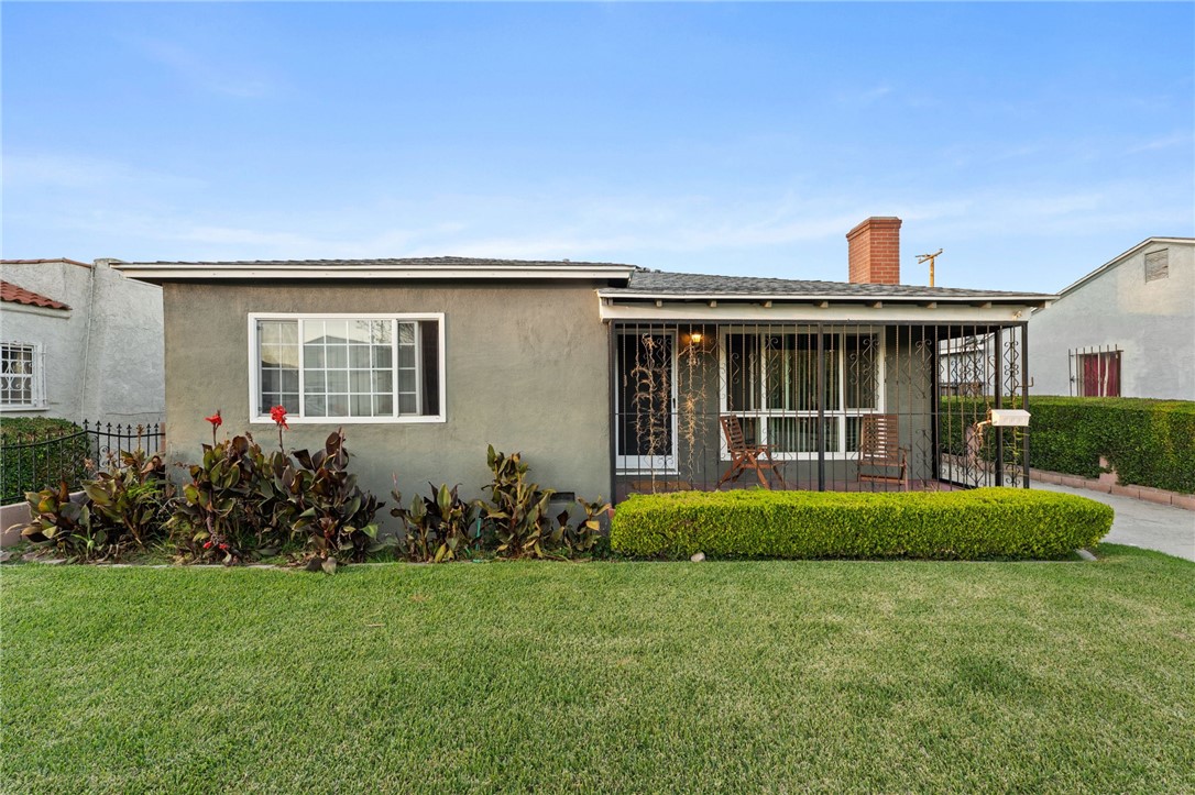 531 West Palmer Street Compton, CA 90220 - Photo 1 of 1 a front view of a house with a garden