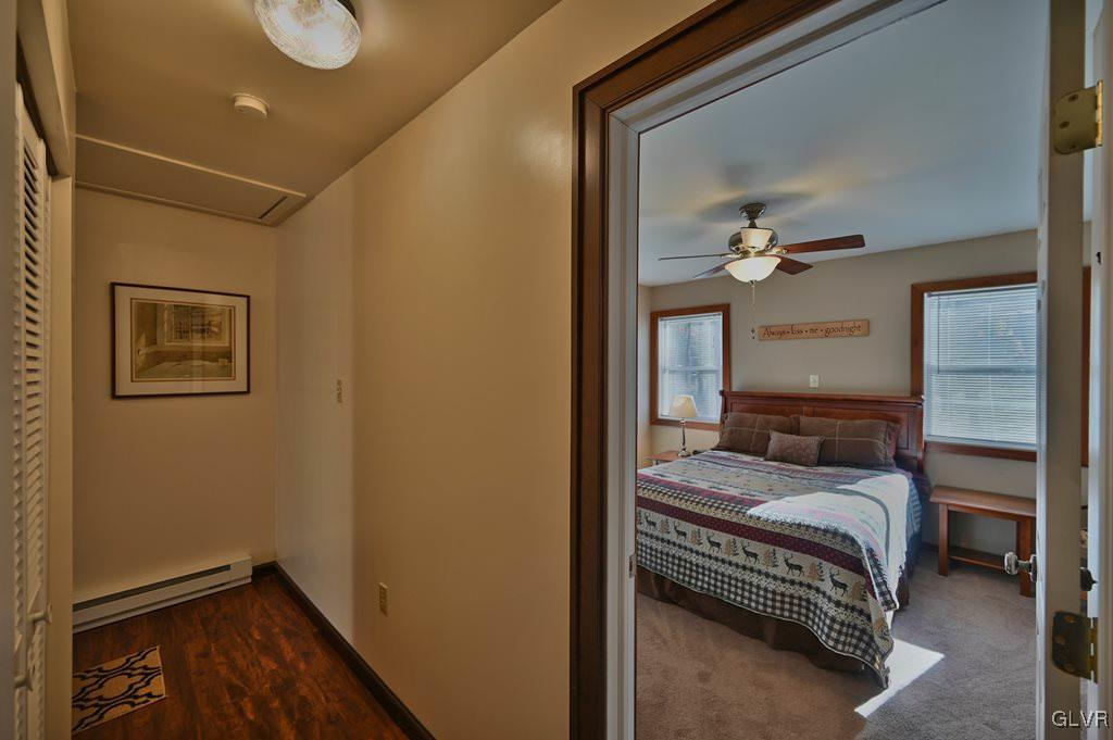 11 Hemlock Path Jim Thorpe, PA 18229 - Photo 14 of 36 a bedroom with a bed and a chandelier