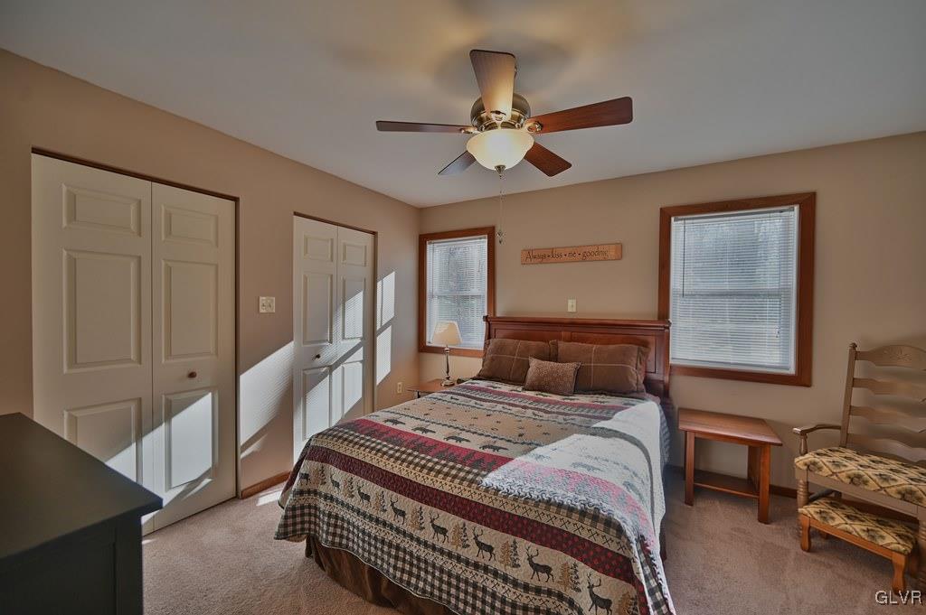 11 Hemlock Path Jim Thorpe, PA 18229 - Photo 15 of 36 a bedroom with a bed a chandelier and a dresser