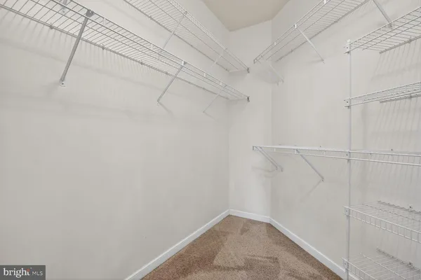 a bathroom with a sink toilet a mirror and shower