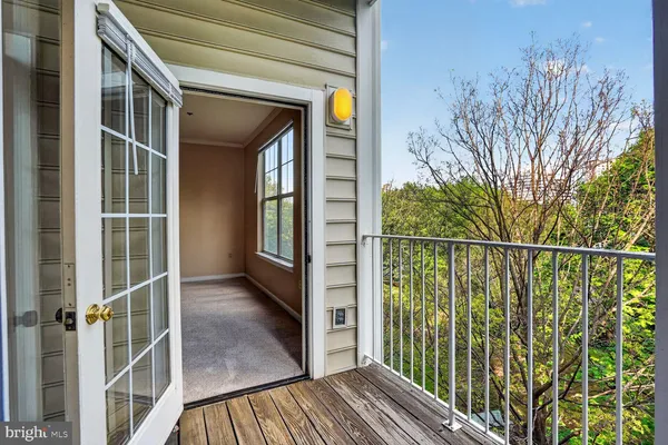 a view of a balcony with wooden floor
