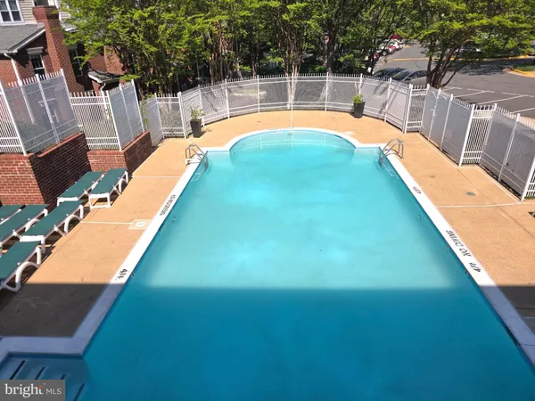 a view of a swimming pool with a patio