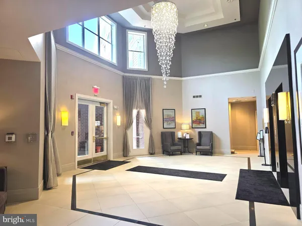 a bedroom with a bed and a mirror