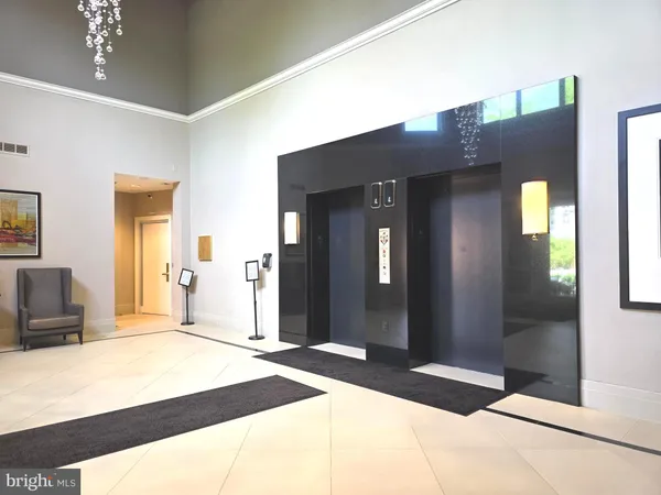 a bedroom with a bed and a large mirror