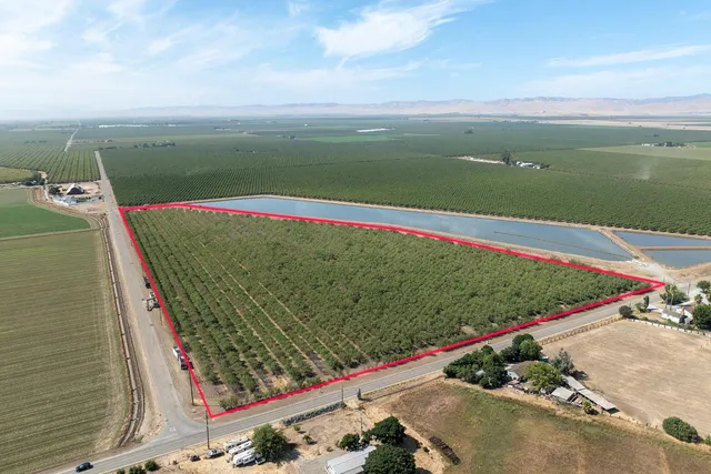 a view of a lake with a floor to ceiling window
