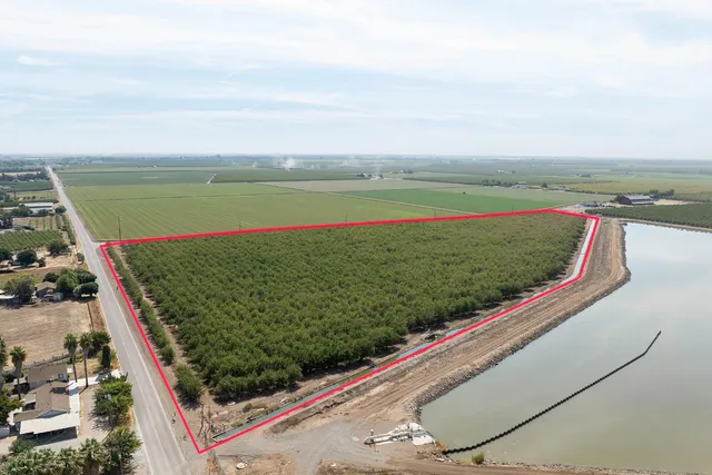 a view of a lake with a floor to ceiling window