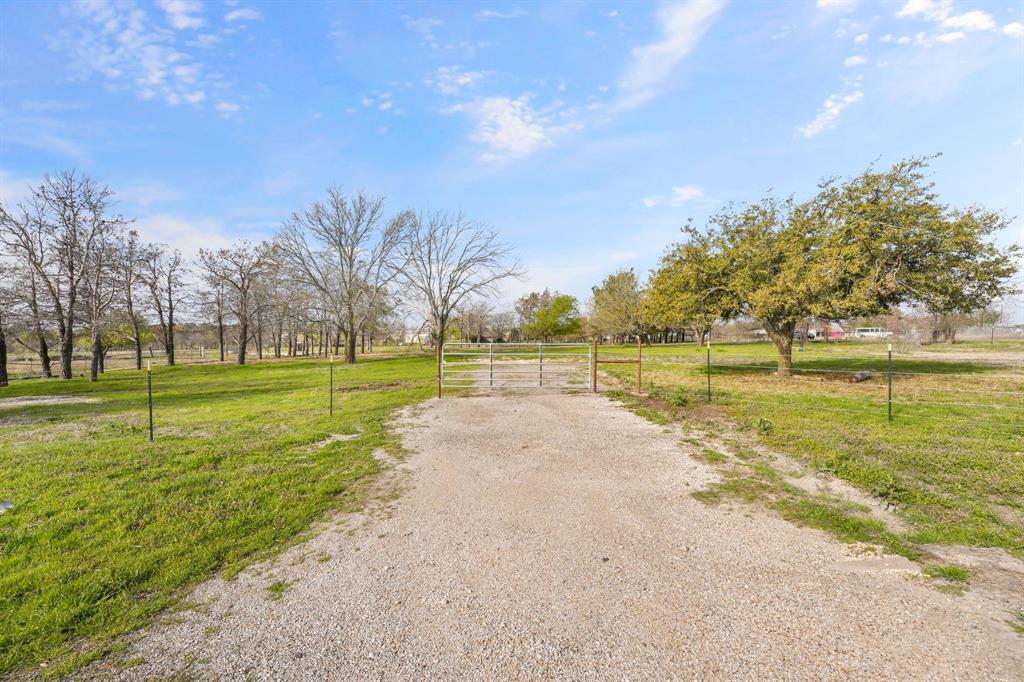 2500 Howell Drive Venus, TX 76084 - Photo 13 of 16 a view of a park with large trees