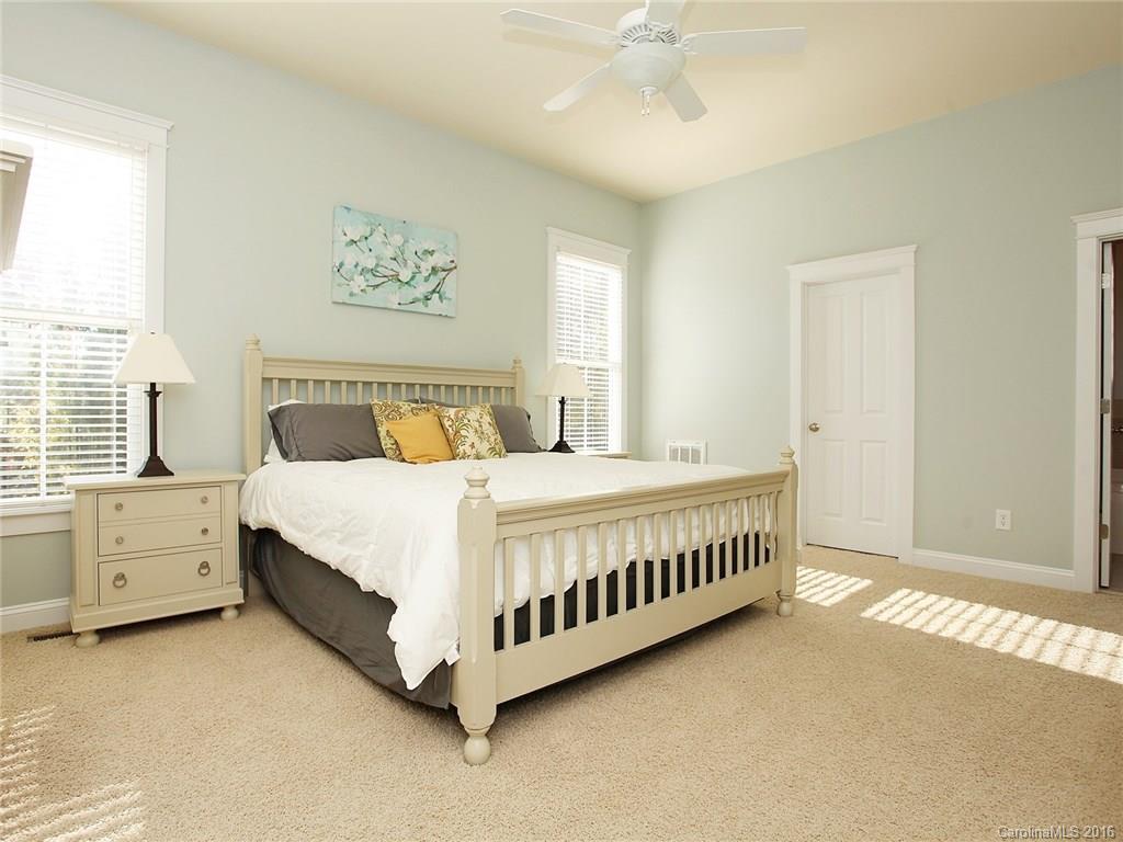 3542 Richard's Crossing Fort Mill, SC 29708 - Photo 15 of 24 a bedroom with a white bed and a chandelier