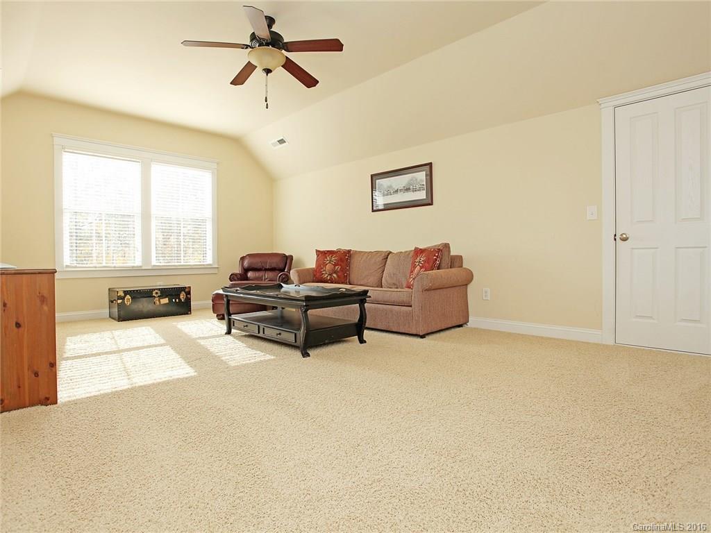 3542 Richard's Crossing Fort Mill, SC 29708 - Photo 18 of 24 a living room with furniture a ceiling fan and a window