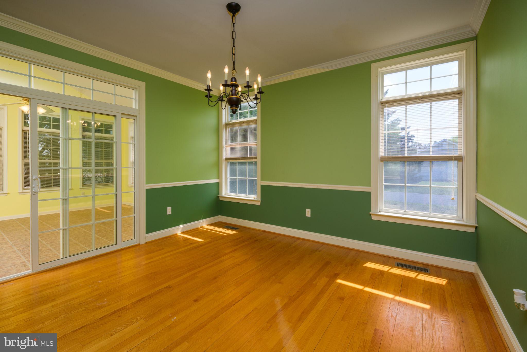 16841 Devon Road Lewes, DE 19958 - Photo 14 of 43 a view of a room with windows and chandelier