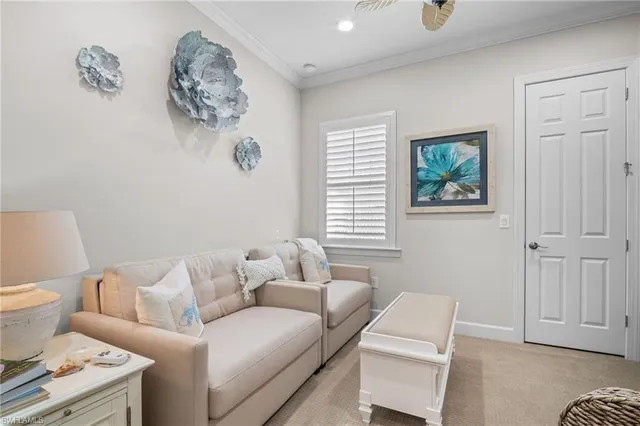 a living room with furniture a couch and a window