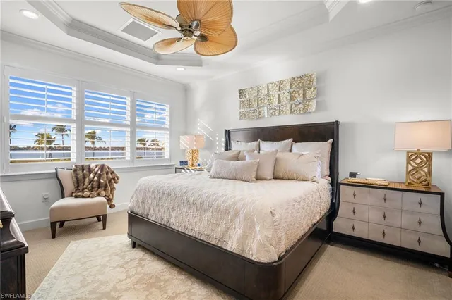 a spacious bedroom with a bed and a couch