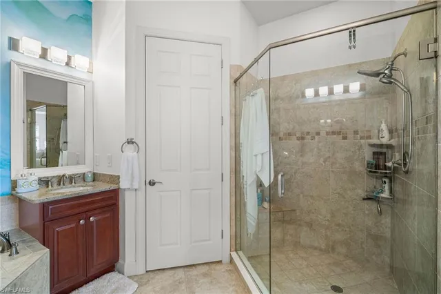 a bathroom with a shower and a sink