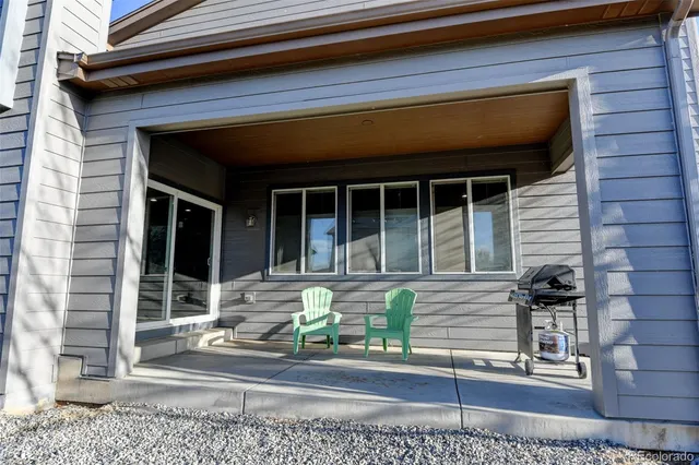 a front view of a house with a window and fire pit