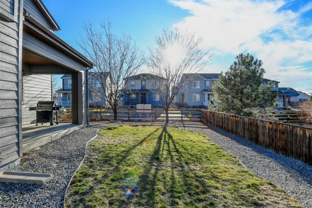 a swimming pool with some trees in the background