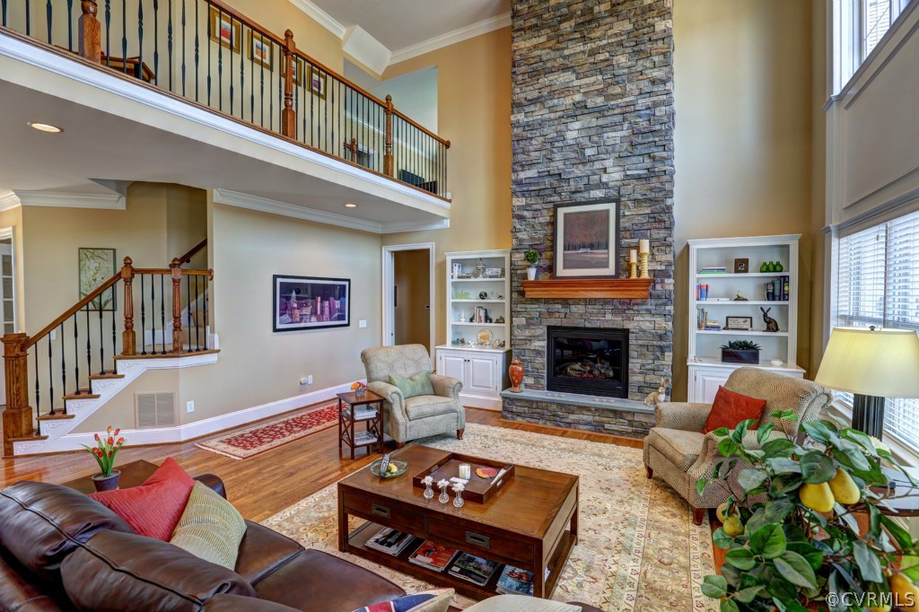 3724 Bircham Loop Midlothian, VA 23113 - Photo 14 of 24 a living room with furniture a fireplace and a dining table