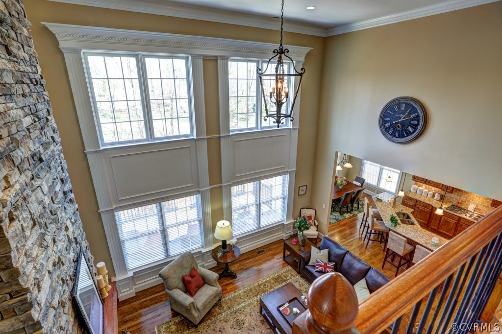 3724 Bircham Loop Midlothian, VA 23113 - Photo 15 of 24 a view of a livingroom with furniture hardwood floor and a ceiling fan