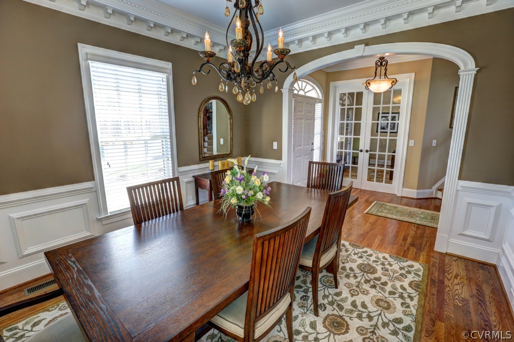 3724 Bircham Loop Midlothian, VA 23113 - Photo 5 of 24 a view of a dining room with furniture wooden floor and chandelier