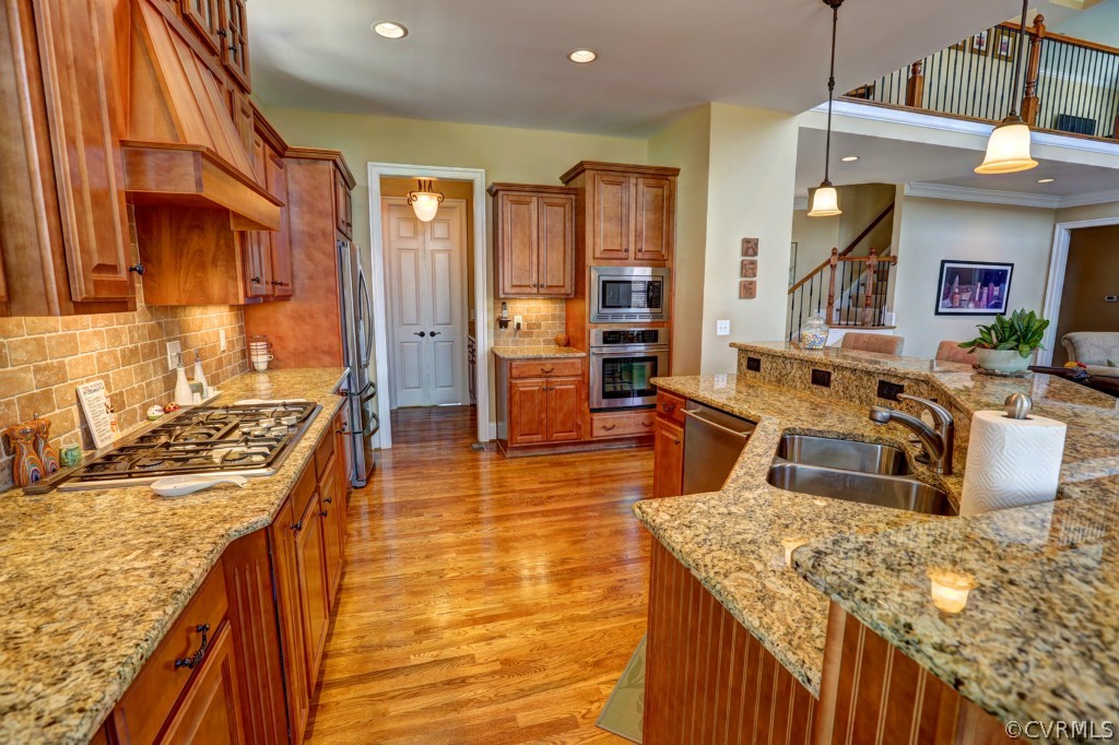 3724 Bircham Loop Midlothian, VA 23113 - Photo 9 of 24 a kitchen with stainless steel appliances granite countertop a sink and stove