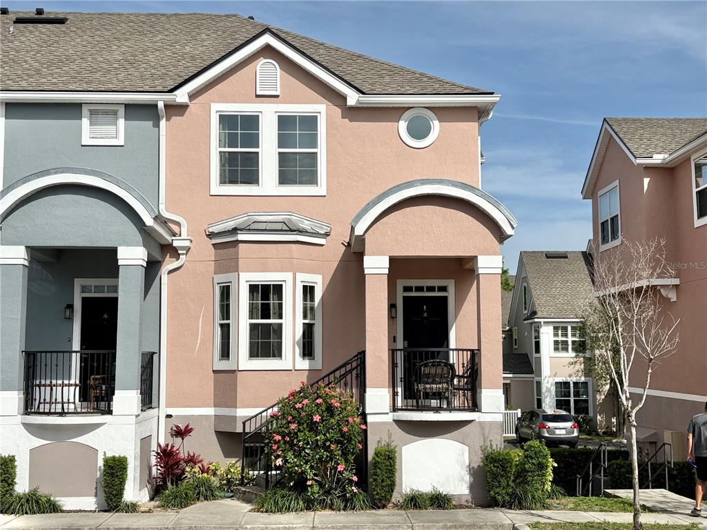 6575 Time Square Avenue, Unit 101 Orlando, FL 32835 - Photo 1 of 1 a view of a brick house with large windows
