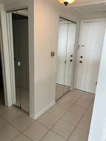 a view of a livingroom with an empty space and a window