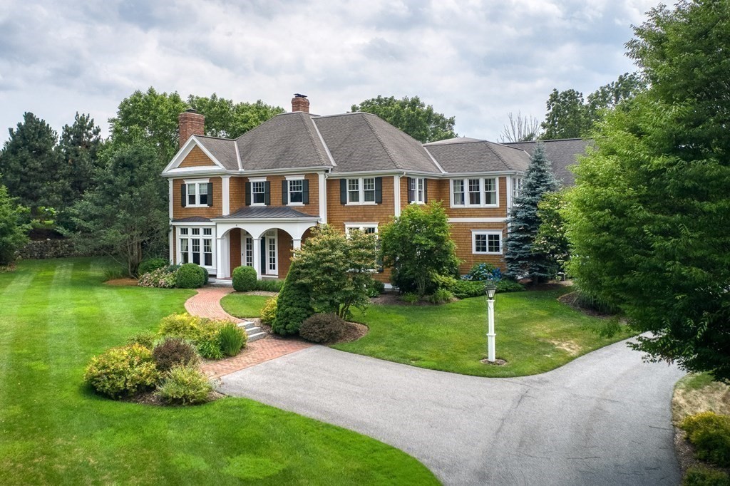 a front view of a house with a yard table and chairs