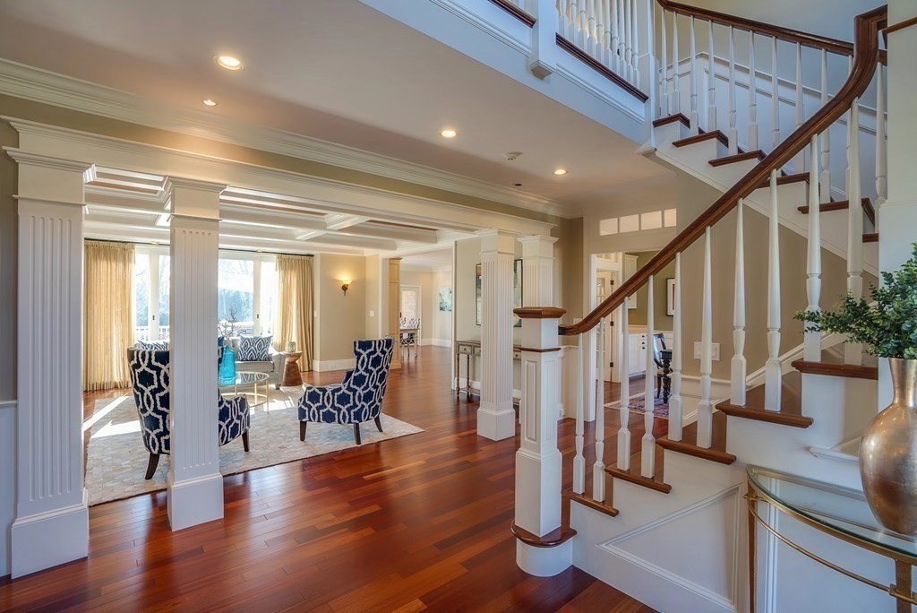 6 High Meadow Road Andover, MA 01810 - Photo 11 of 41 a living room with wooden floors and stairs
