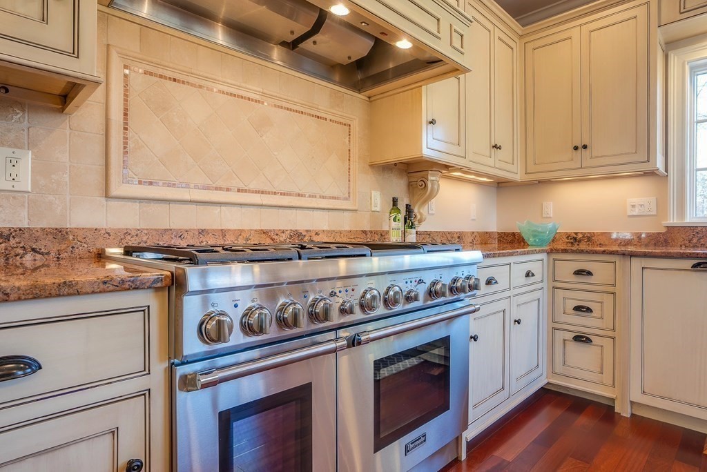 6 High Meadow Road Andover, MA 01810 - Photo 14 of 41 a kitchen with stainless steel appliances granite countertop a stove and a white cabinets