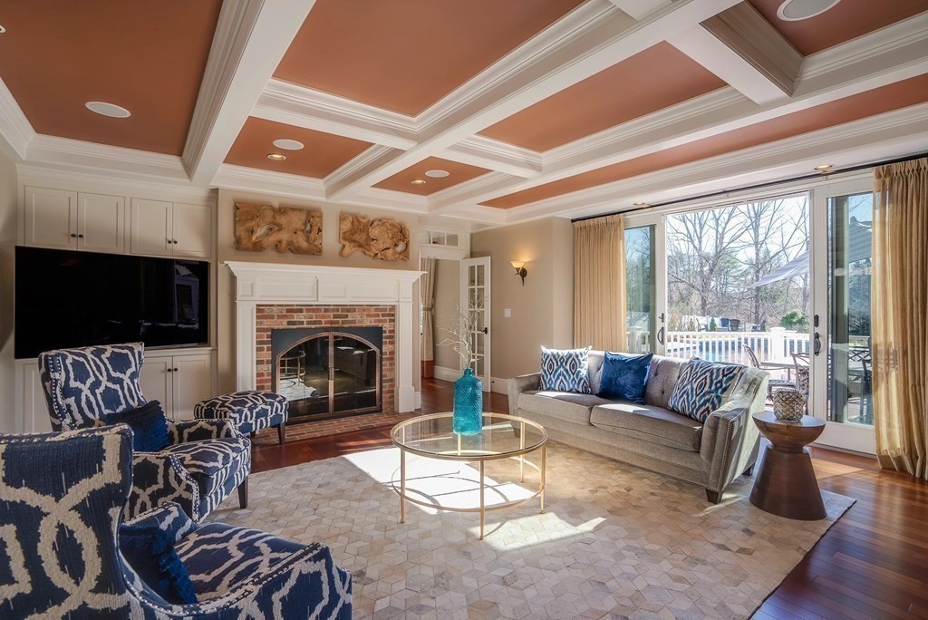 6 High Meadow Road Andover, MA 01810 - Photo 19 of 41 a living room with furniture a flat screen tv and a fireplace