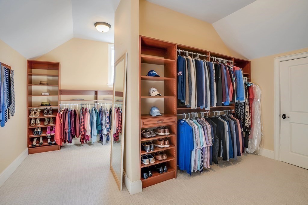 6 High Meadow Road Andover, MA 01810 - Photo 31 of 41 a view of walk in closet with clothes and shoes