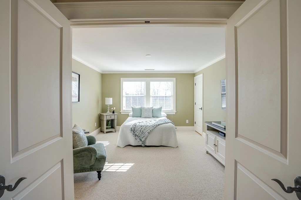 6 High Meadow Road Andover, MA 01810 - Photo 32 of 41 a spacious bedroom with a bed and a couch