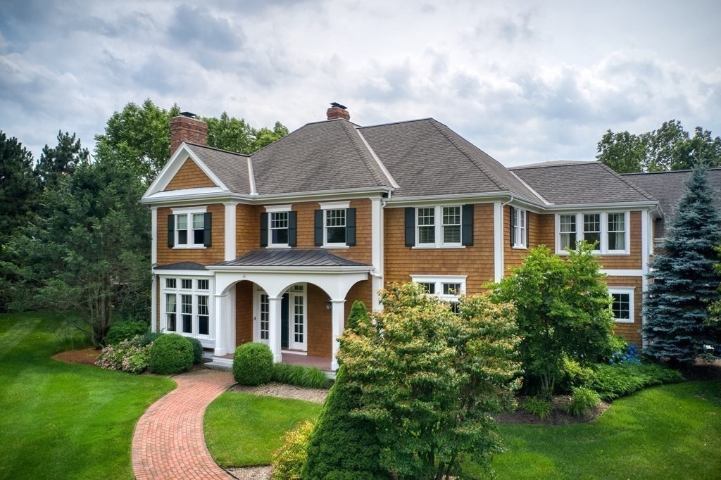 6 High Meadow Road Andover, MA 01810 - Photo 38 of 41 a view of a white house with a big yard and potted plants