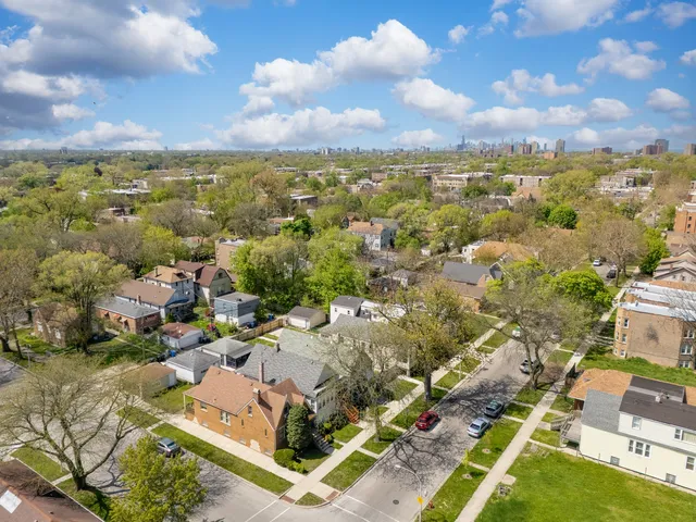 an aerial view of residential houses with outdoor space