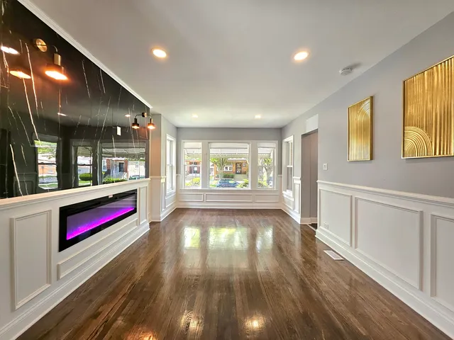 a view of an entryway with wooden floor and windows