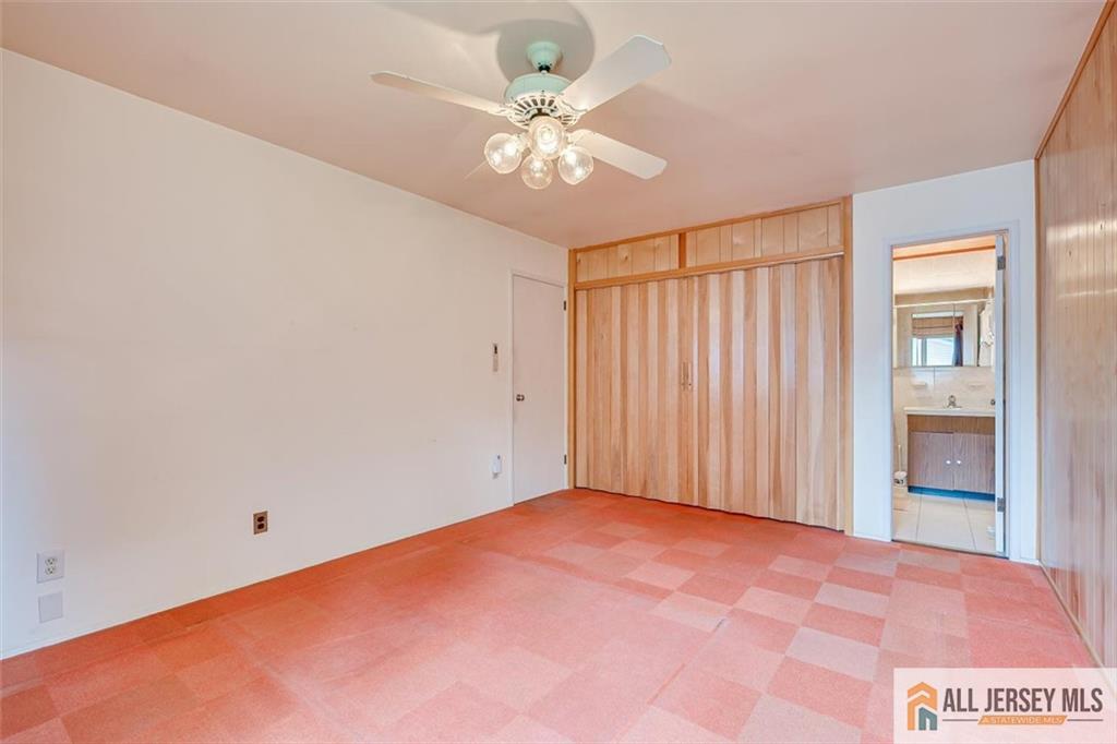 21 Tyndall Road Kendall Park, NJ 08824 - Photo 13 of 33 wooden floor in an empty room with a window