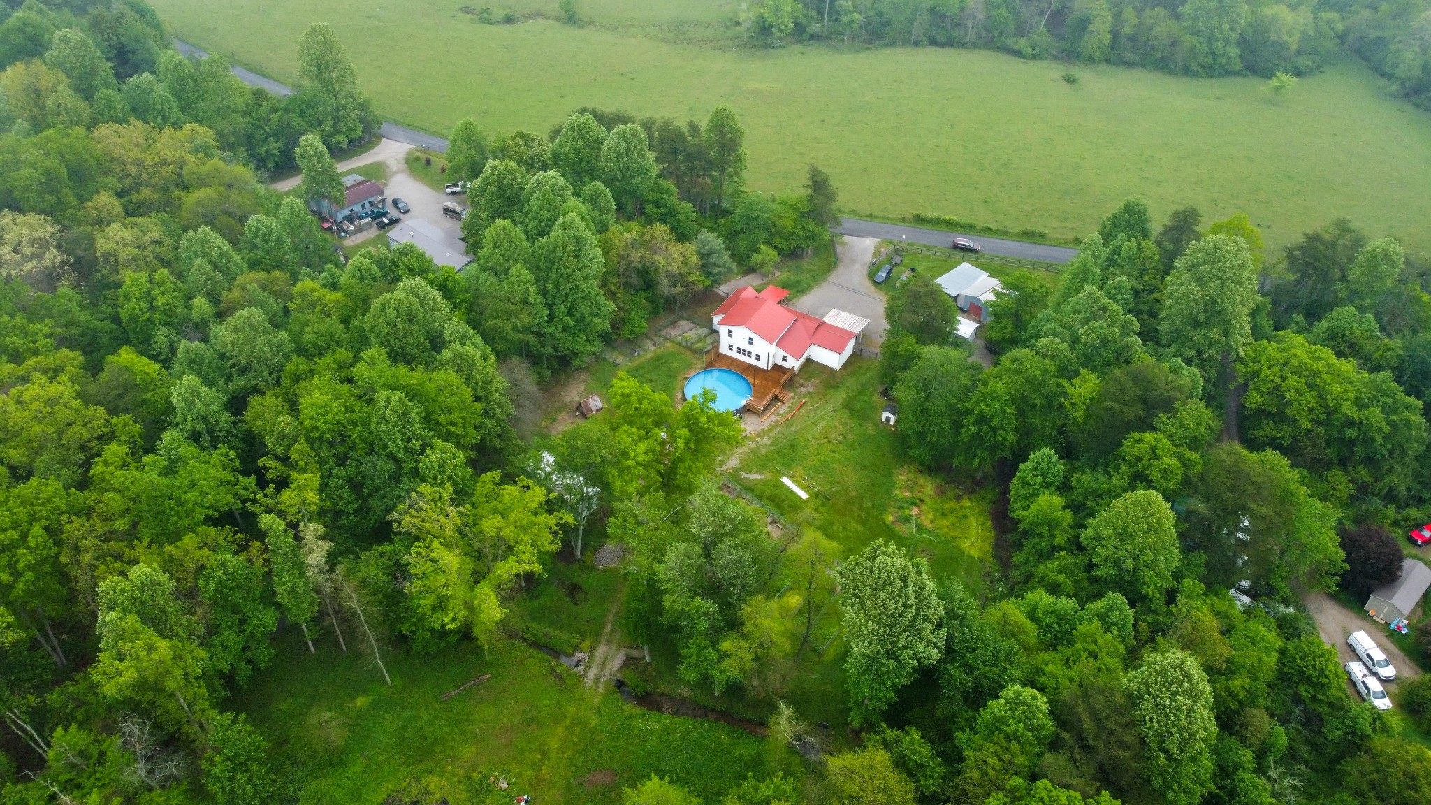 494 Lovejoy Road Sparta, TN 38583 - Photo 11 of 54 a backyard of a house with lots of green space and lake view