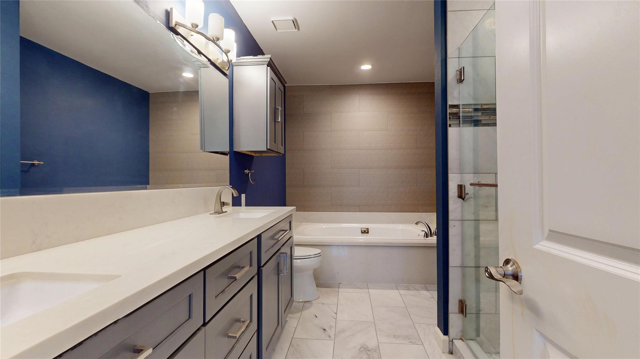 2984 Holly Hall Street Houston, TX 77054 - Photo 15 of 23 a bathroom with a sink a toilet and a bathtub