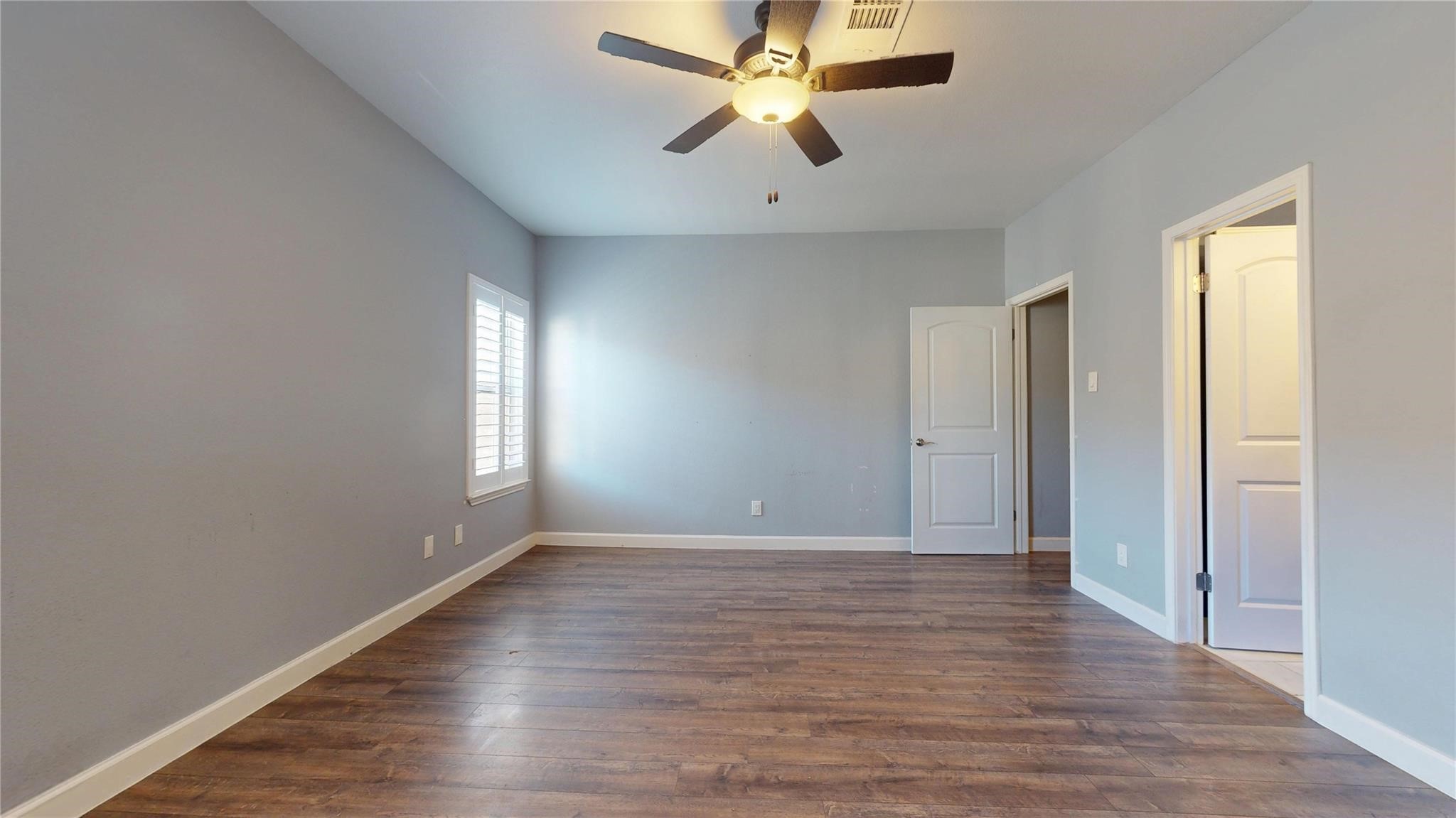 2984 Holly Hall Street Houston, TX 77054 - Photo 19 of 23 wooden floor in an empty room with a window