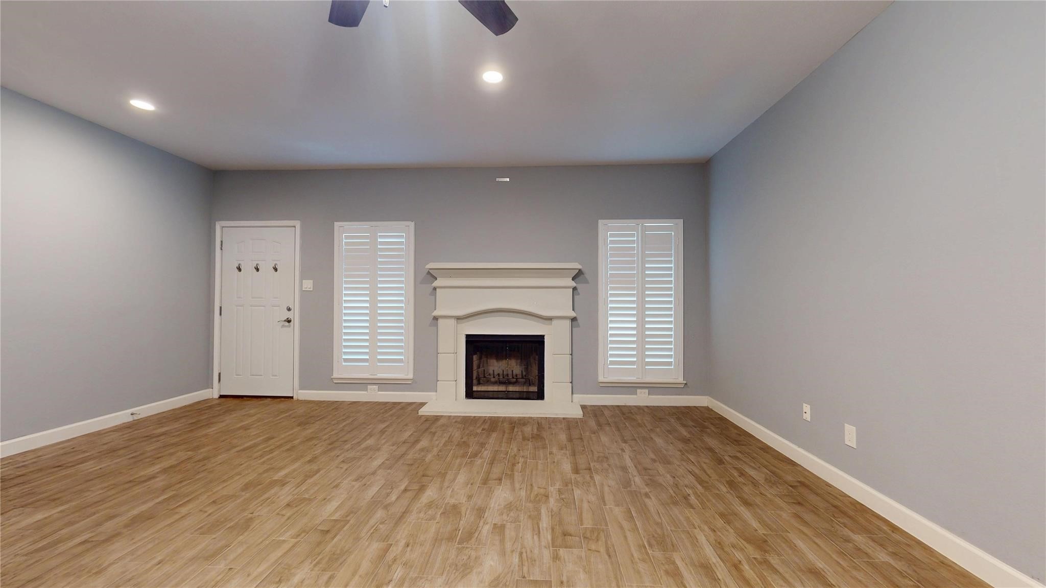 2984 Holly Hall Street Houston, TX 77054 - Photo 3 of 23 a view of an empty room with a fireplace and a window