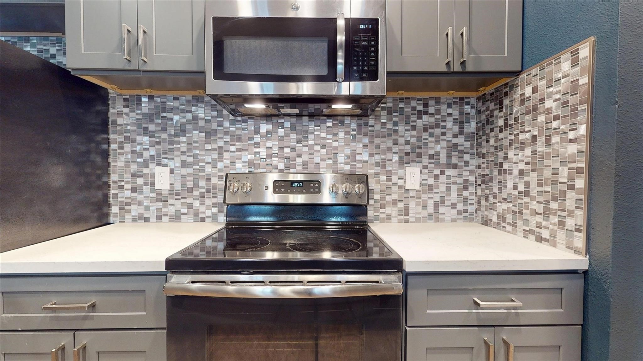 2984 Holly Hall Street Houston, TX 77054 - Photo 6 of 23 a stove top oven sitting inside of a kitchen