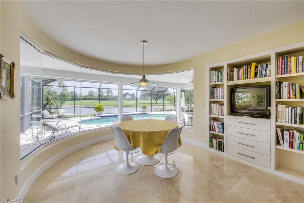 2260 Imperial Golf Course Boulevard Naples, FL 34110 - Photo 13 of 29 a view of a dining room with furniture window and outside view