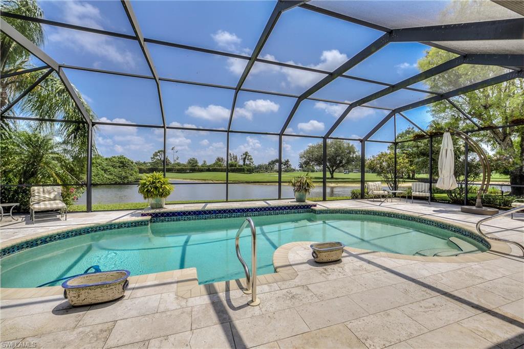 2260 Imperial Golf Course Boulevard Naples, FL 34110 - Photo 2 of 29 a view of a swimming pool with a patio